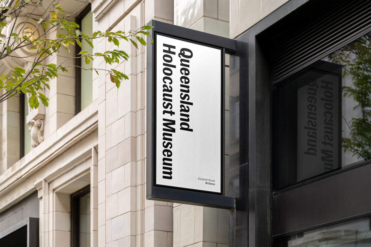 Sign for the Queensland Holocaust Museum featuring the logo